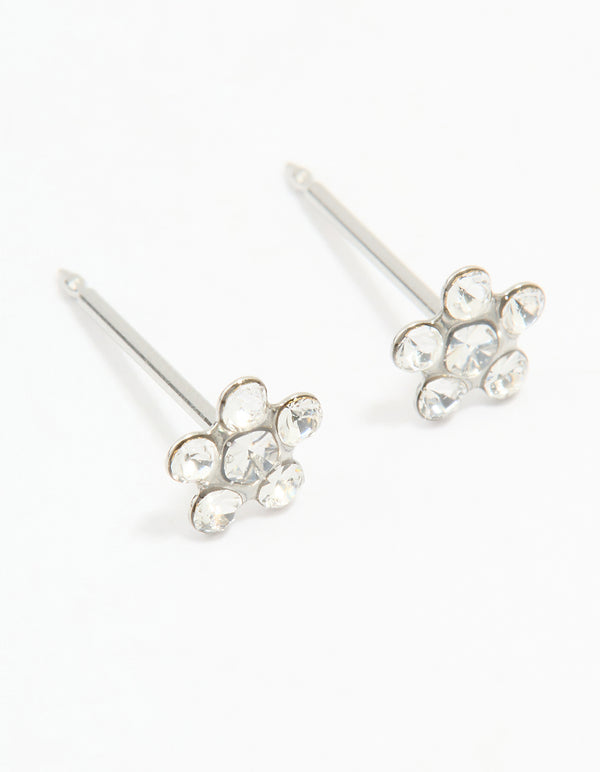 Discover dainty surgical stainless steel cubic zirconia daisy piercing studs in silver and clear front view