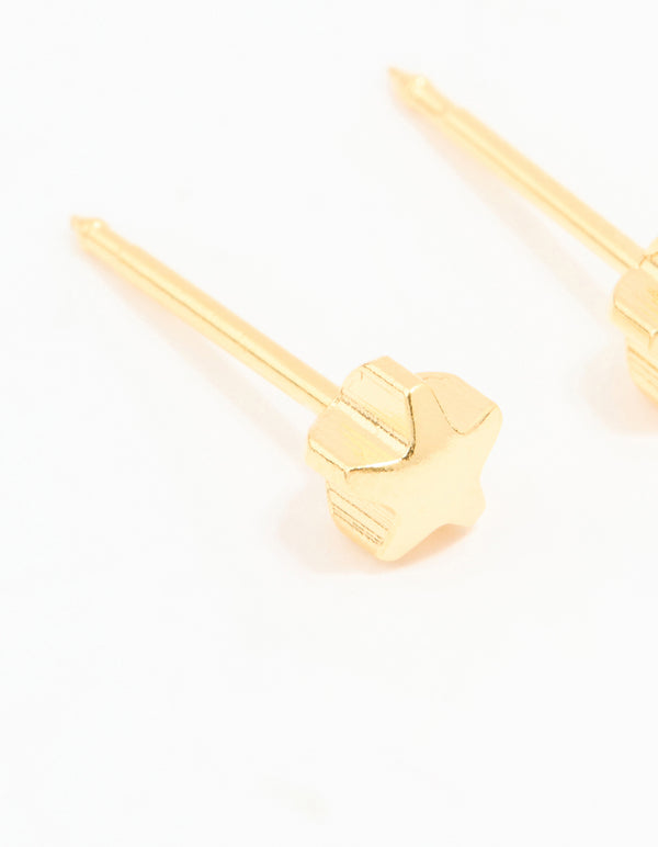 Featuring 24K gold plated surgical stainless steel 4MM star piercing studs with celestial design and stud closure close up view