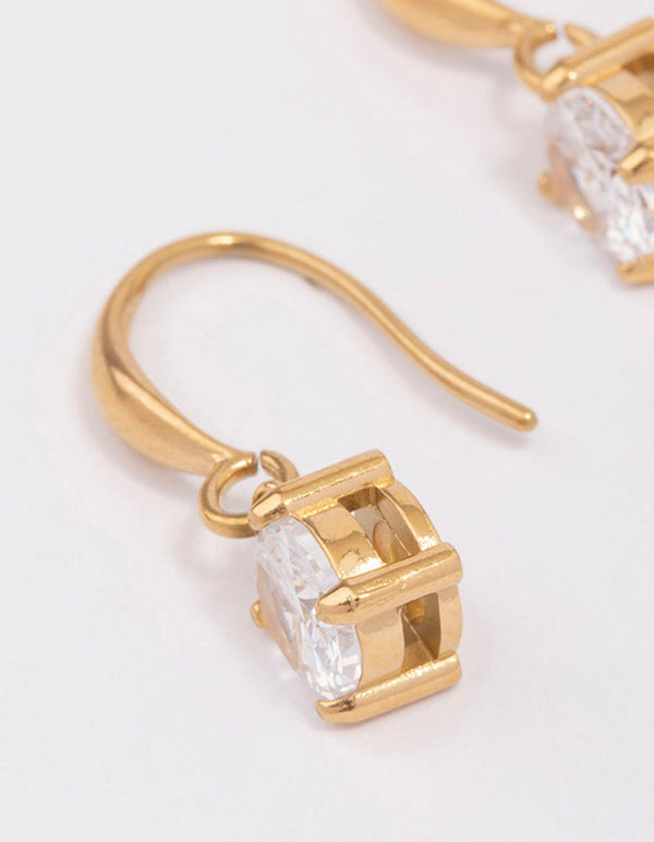 Highlighting waterproof solitaire french hook earrings crafted from gold plated stainless steel featuring cubic zirconia in white close up view