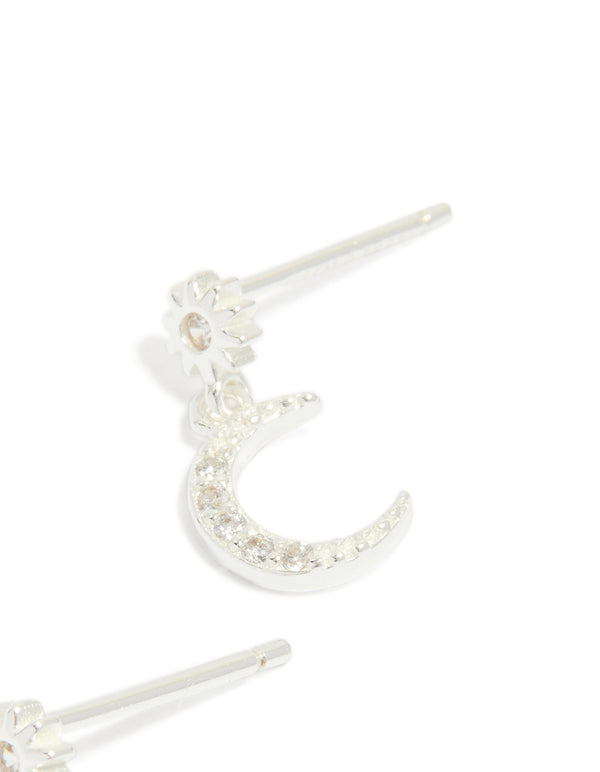Displaying sterling silver cubic zirconia drop stud earrings featuring celestial moon design in dainty style post detail view