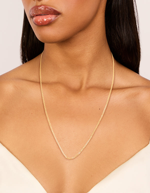 Crafted from gold plated sterling silver, this long chain necklace features dainty design on neck view
