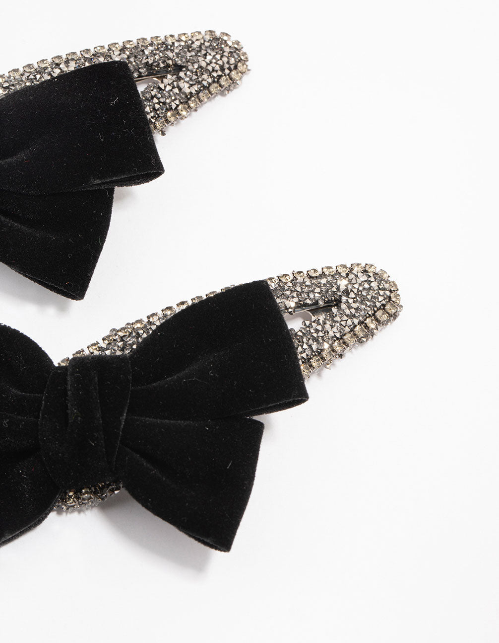 Elegant mixed beaded velvet bow clips in a 2-pack featuring solid black and silver tones detail view