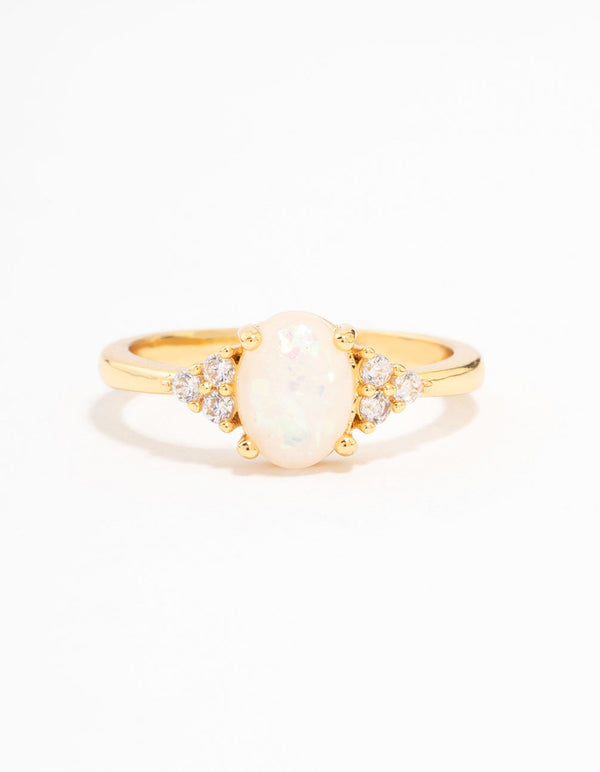 Elegant gold plated mystical oval ring featuring dainty design with ivory white stone setting front view