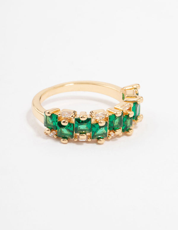 Showcasing a gold plated staggered band ring featuring emerald cut cubic zirconia in dark green front view