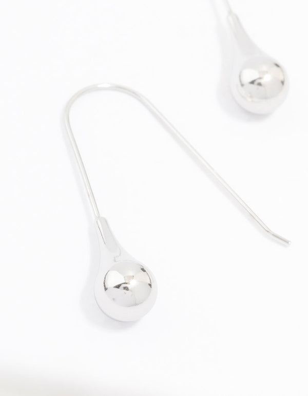 Featuring waterproof stainless steel thread through earrings with ball detail in silver close up view