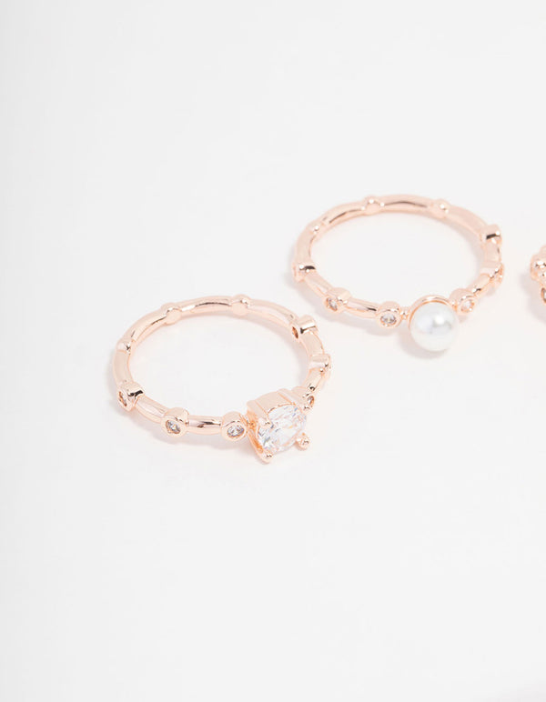 Showcasing rose gold plated cubic zirconia pearl bamboo ring in a 3-pack with floral design and dainty styling close up view