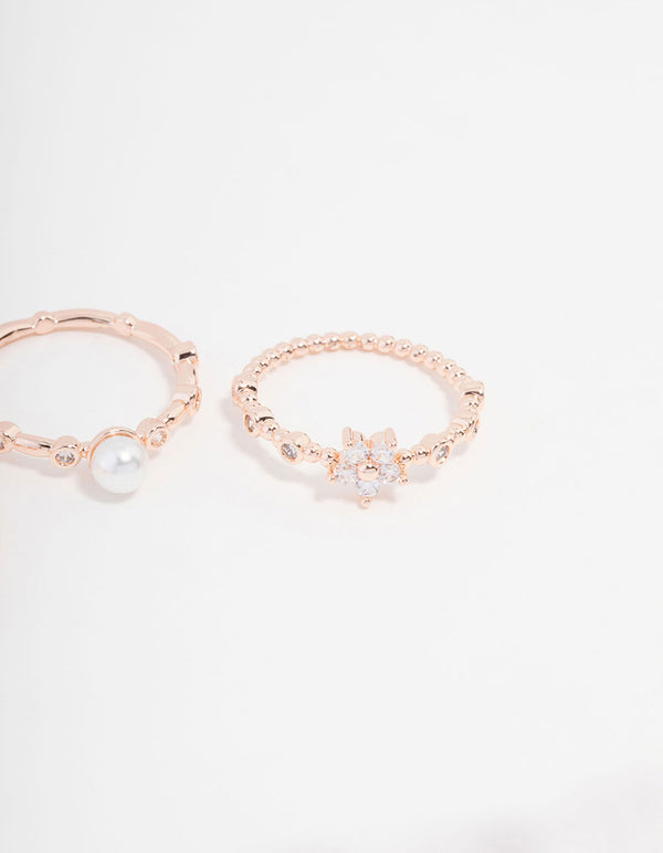 Showcasing rose gold plated cubic zirconia pearl bamboo ring in a 3-pack with floral design and dainty styling close up view