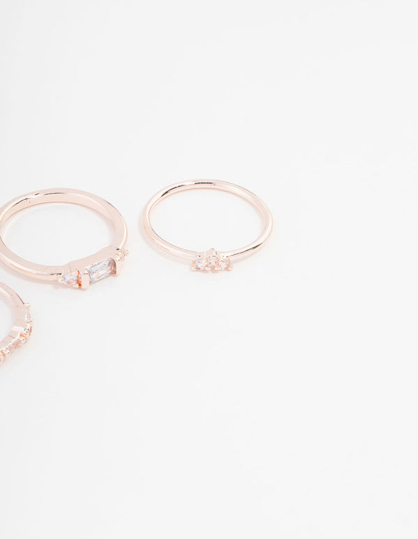 Crafted with baguette and round stone cuts, this rose gold plated cubic zirconia ring set is displayed in close up view