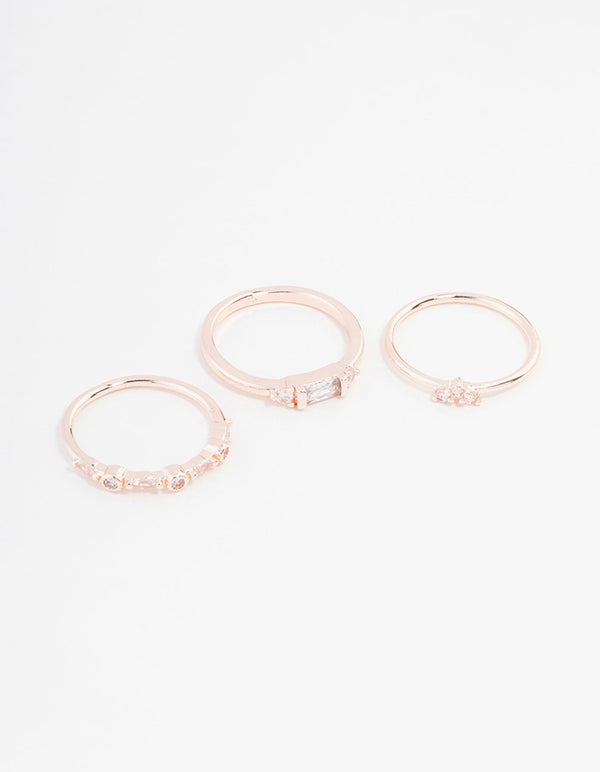 Showcasing a rose gold plated baguette and mini round cubic zirconia ring 3-pack front view