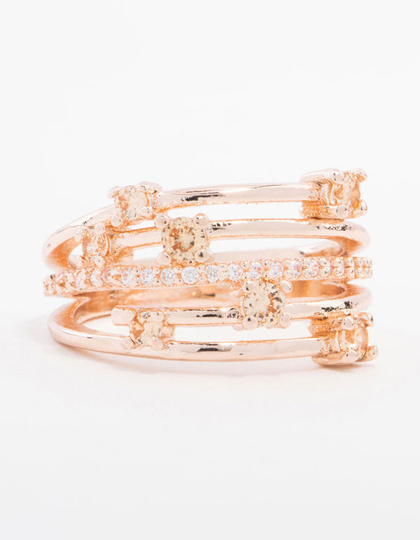 This statement rose gold plated cubic zirconia pave and scatter ring features multi-band construction front view