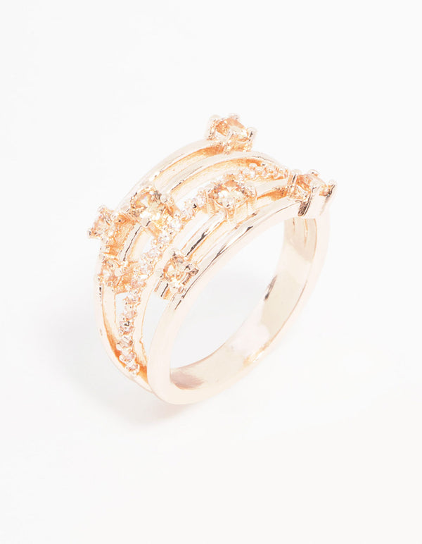 Showcasing a statement rose gold plated cubic zirconia pave and scatter ring with multiple bands side detail view
