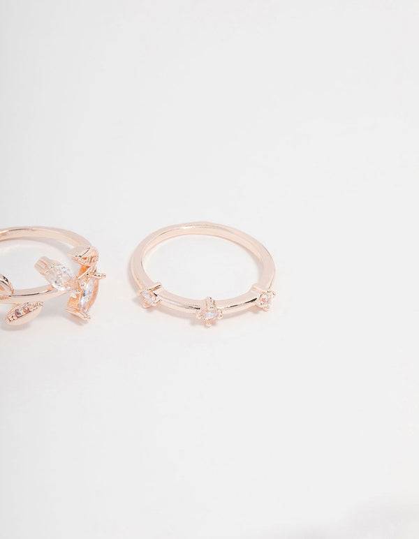 Showcasing rose gold plated cubic zirconia leafy station rings close up view