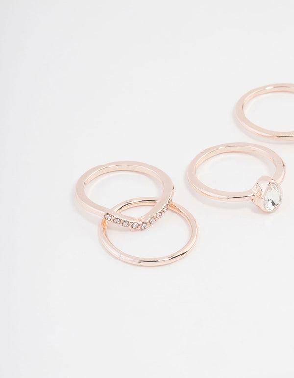 Showcasing rose gold plated square and pear ring 5-pack with stones close up view