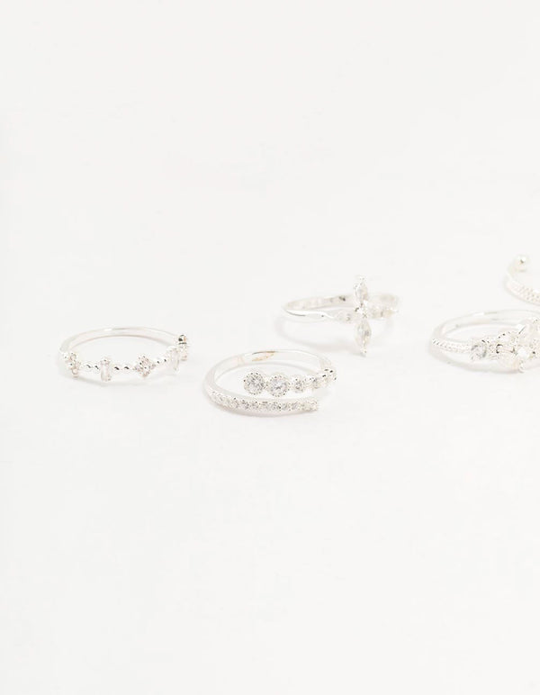 Highlighting leafy mixed rings 5-pack with floral accents crafted from cubic zirconia in gold plated metal close up view