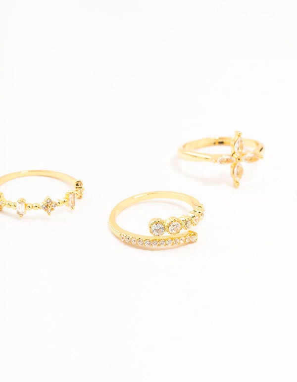 Stunning gold plated cubic zirconia leafy mixed rings 5-pack with floral accents in clear tones close up view