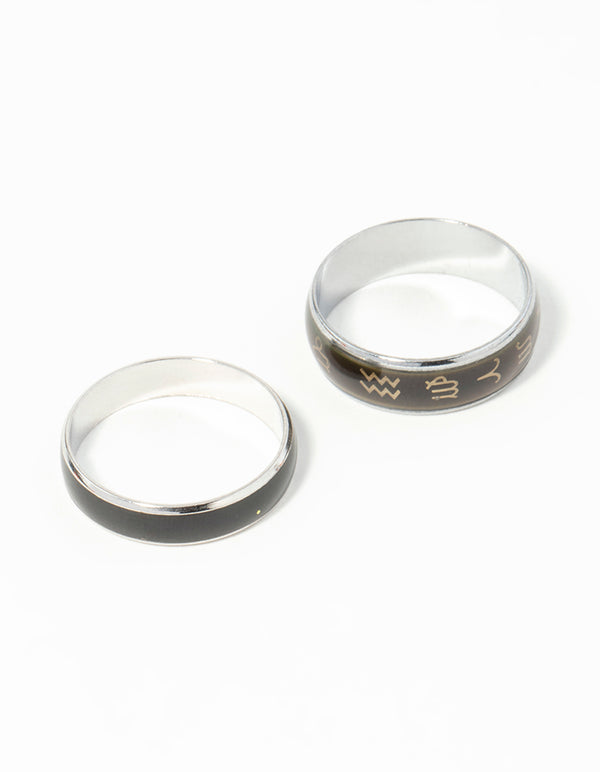 Showcasing celestial silver symbol mood ring set with black and gold accents front view