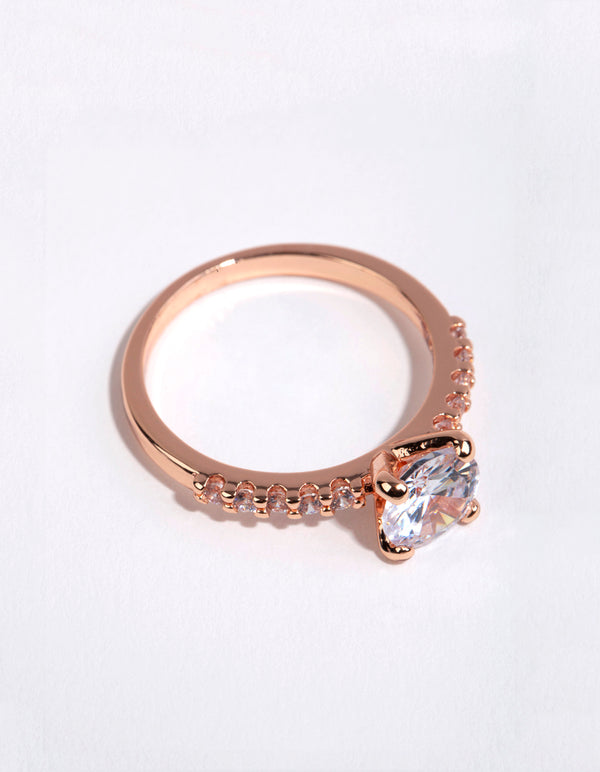 Elegant rose gold plated cubic zirconia round band ring featuring prong setting and pavé details front view