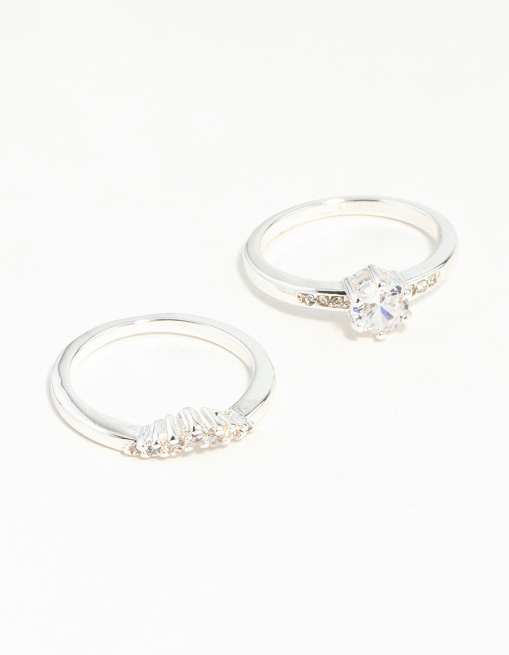 Showcasing a silver plated stackable ring set with round cut cubic zirconia stones front view