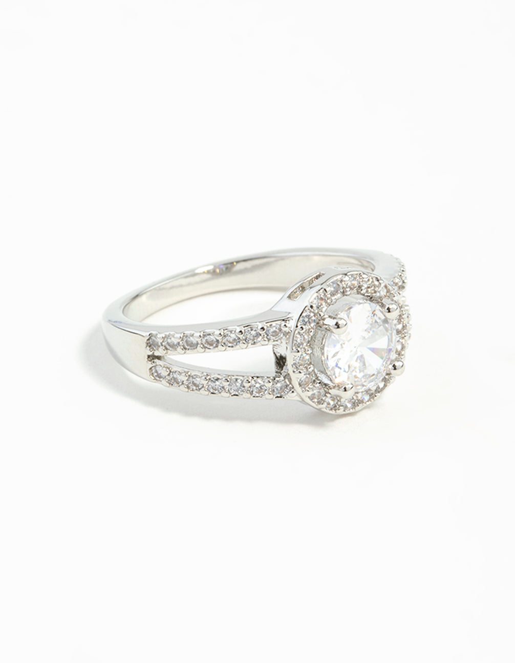 Crafted from silver plated material, this cubic zirconia halo ring features a clear stone in an elegant setting front view