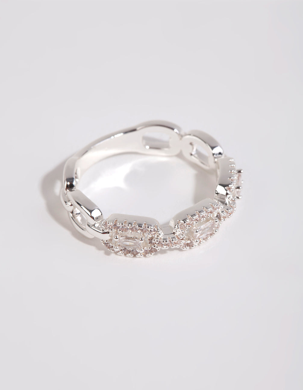 Crafted from silver plated material, this cubic zirconia chain ring in white side detail view