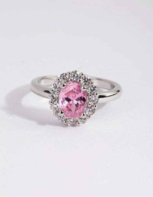 Elegant silver pink cubic zirconia oval ring with light halo setting close up view