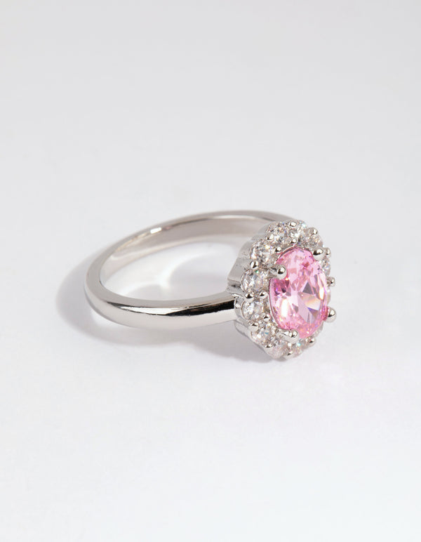 Showcasing a silver pink cubic zirconia oval ring with light halo setting front view