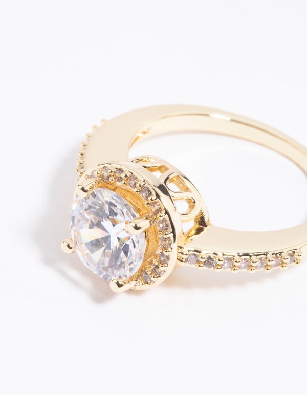 Highlighting a gold cubic zirconia solitaire ring in plated metal with statement details close up view