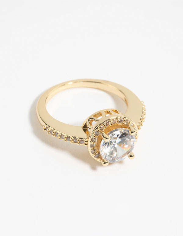 Showcasing a gold cubic zirconia solitaire ring crafted from plated metal with statement styling front view