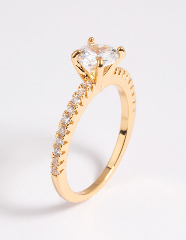 Highlighting a gold plated cubic zirconia round textured band ring with crystal prong setting side detail view