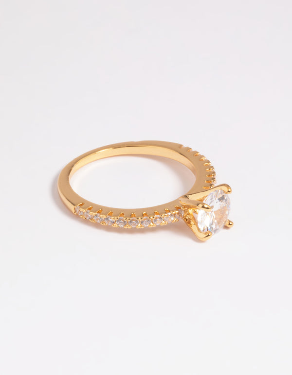 Showcasing a gold plated cubic zirconia round textured band ring with crystal accents close up view