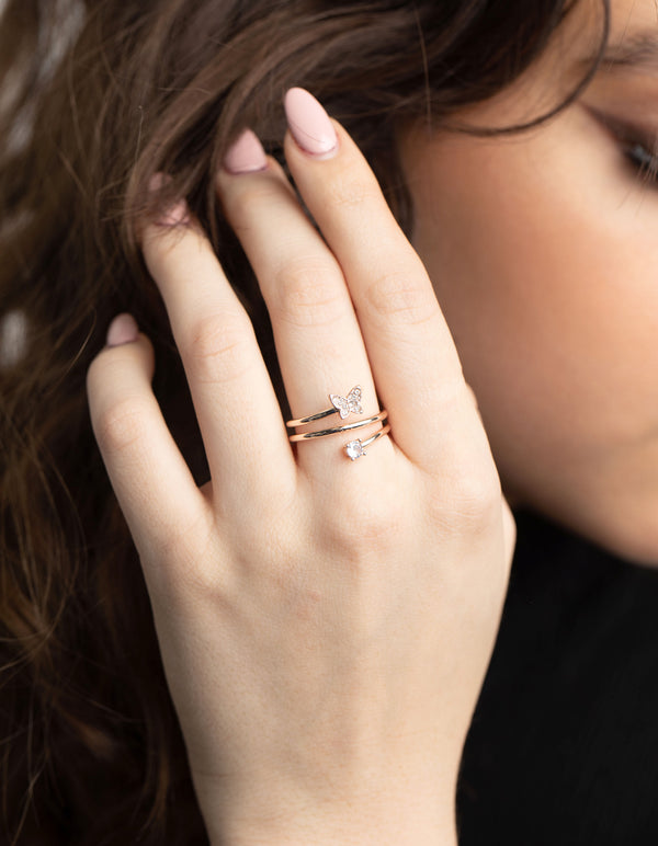 Featuring a rose gold mini butterfly wrapped ring with statement detailing on finger view