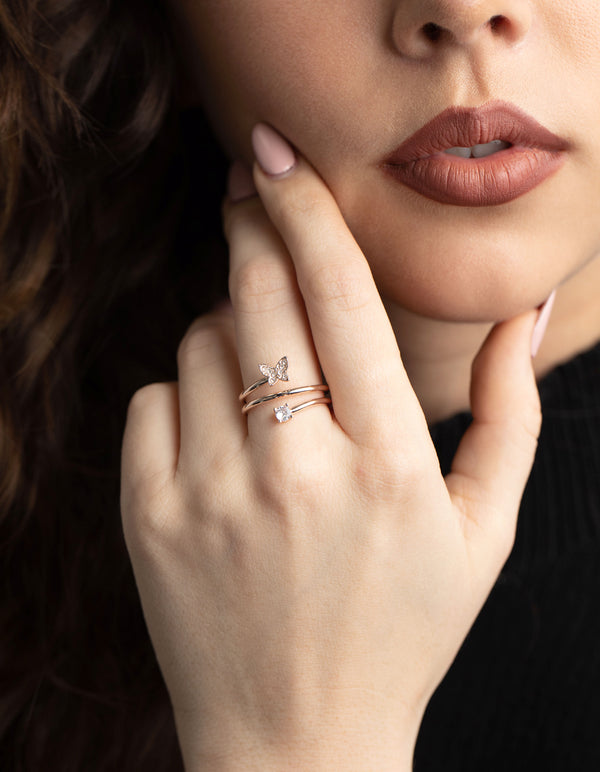 Featuring a rose gold mini butterfly wrapped ring with statement detailing on finger view