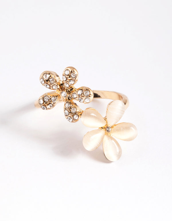 Showcasing a gold diamante and cateye flower ring in statement style front view