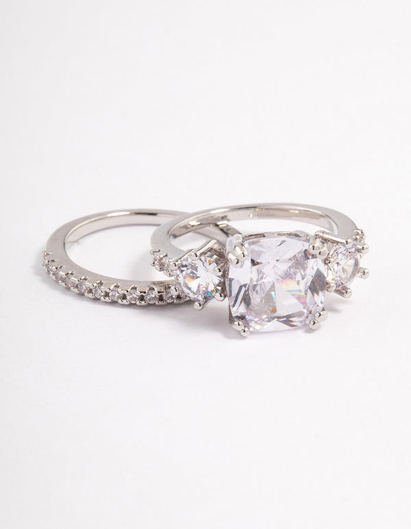 Showcasing a triple stone ring set in silver featuring clear gemstones front view