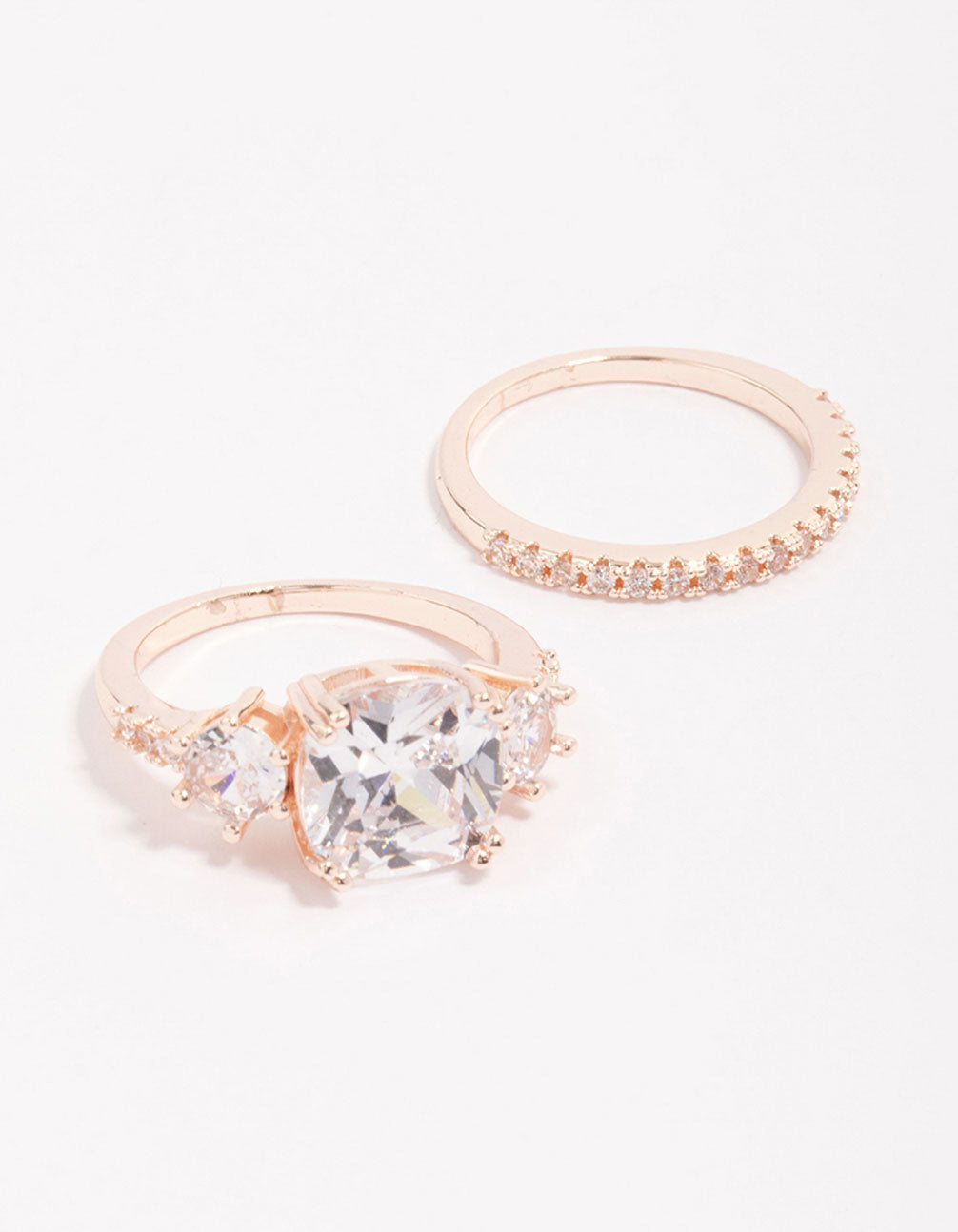 Elegant rose gold triple stone ring set featuring cubic zirconia front view