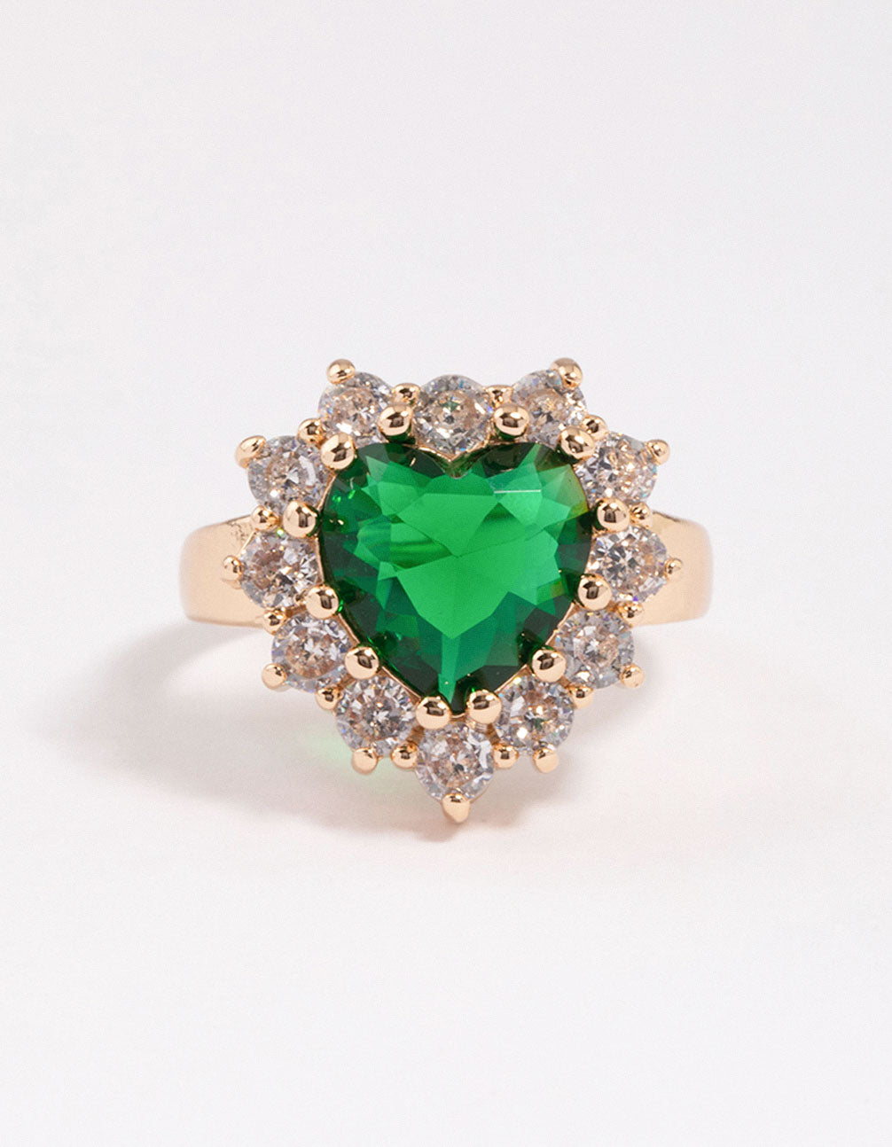 Crafted with dainty styling, this heart ring in gold features lime green stone close up view