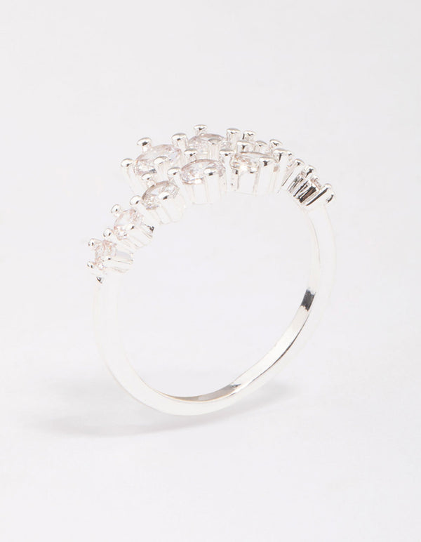 Showcasing a dainty silver plated graduating cubic zirconia wrapped ring side detail view