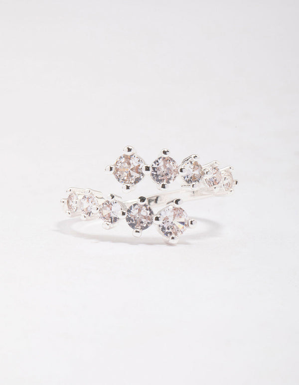 Highlighting a dainty silver plated graduating cubic zirconia wrapped ring close up view