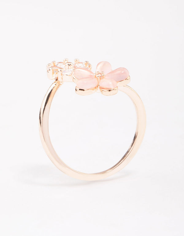 Featuring a rose gold double daisy wrapped ring with floral design side detail view