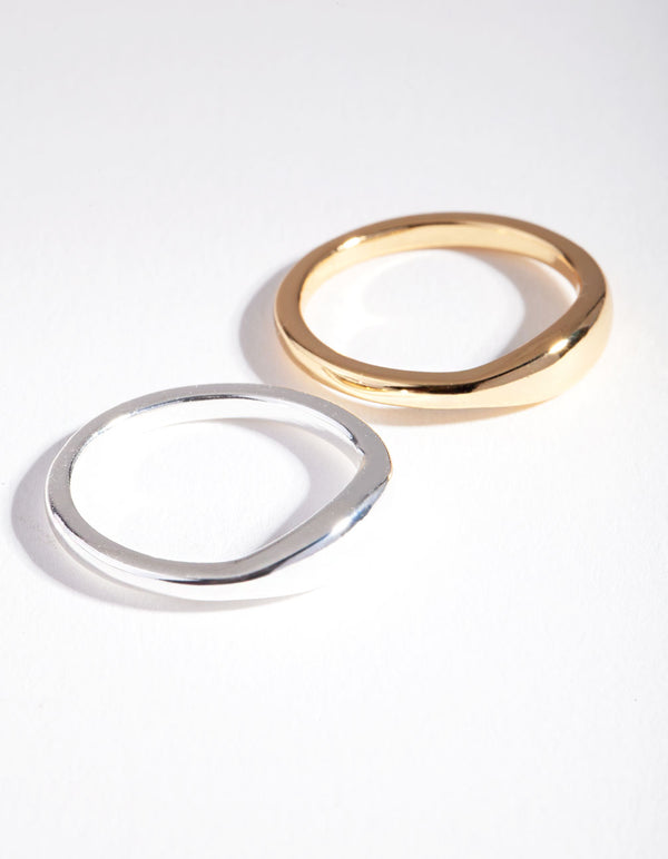 Showcasing a silver and gold plated wave band ring set front view