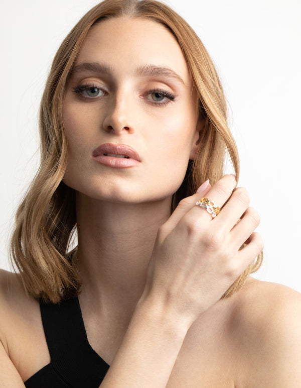 Showcasing a gold plated double chain ring on finger view