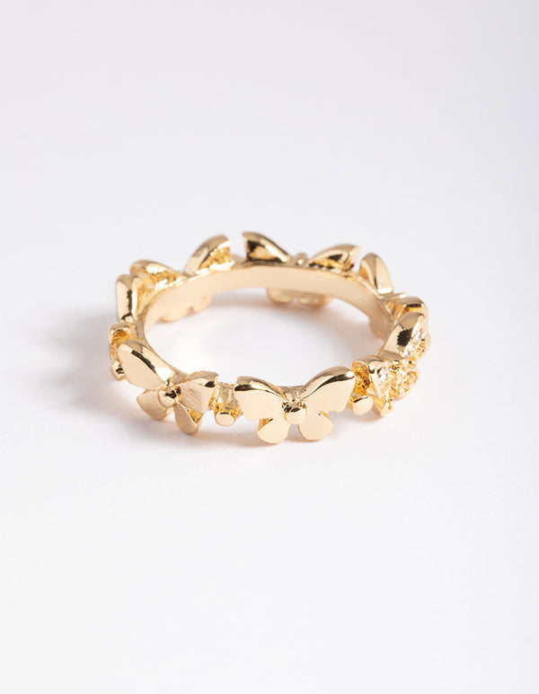 Featuring a dainty gold butterfly band ring crafted from plated material side detail view