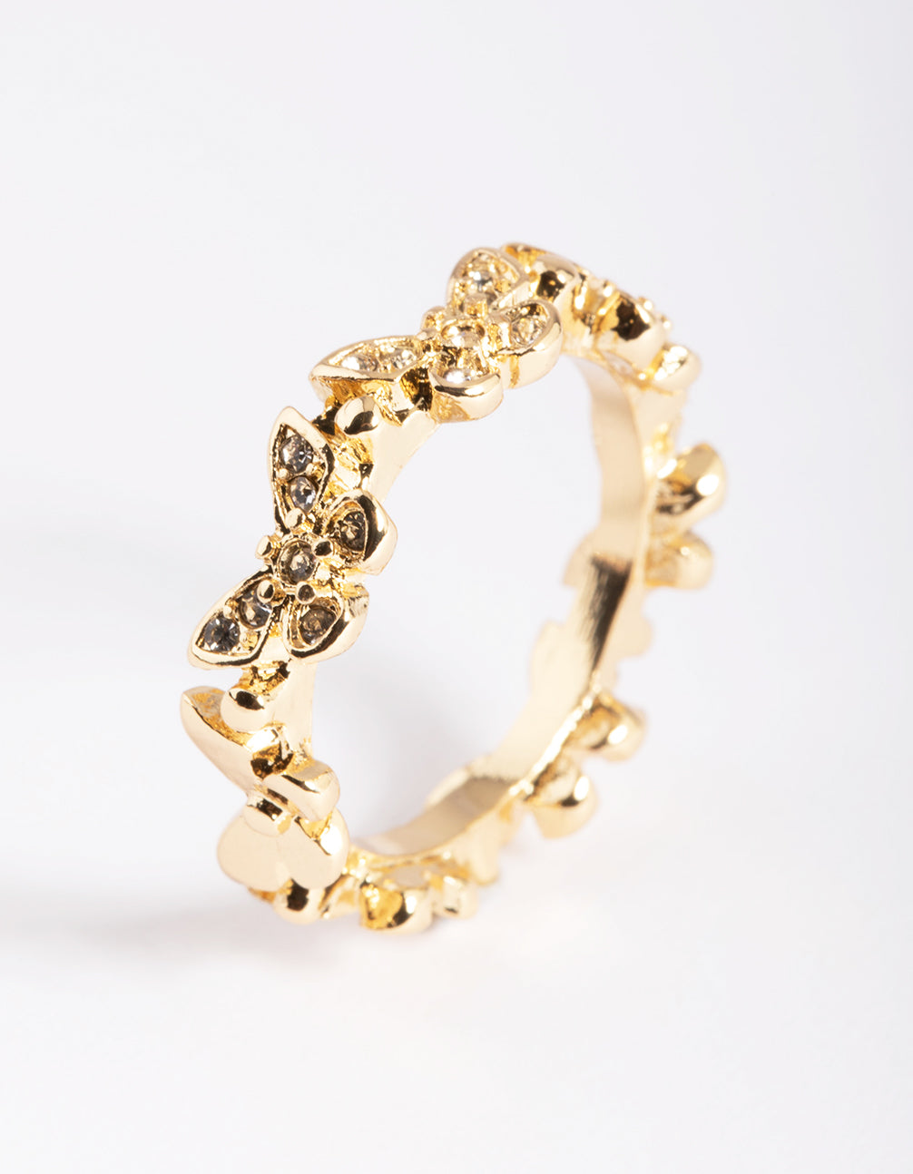 Highlighting a dainty gold butterfly band ring crafted from plated material in dainty style close up view