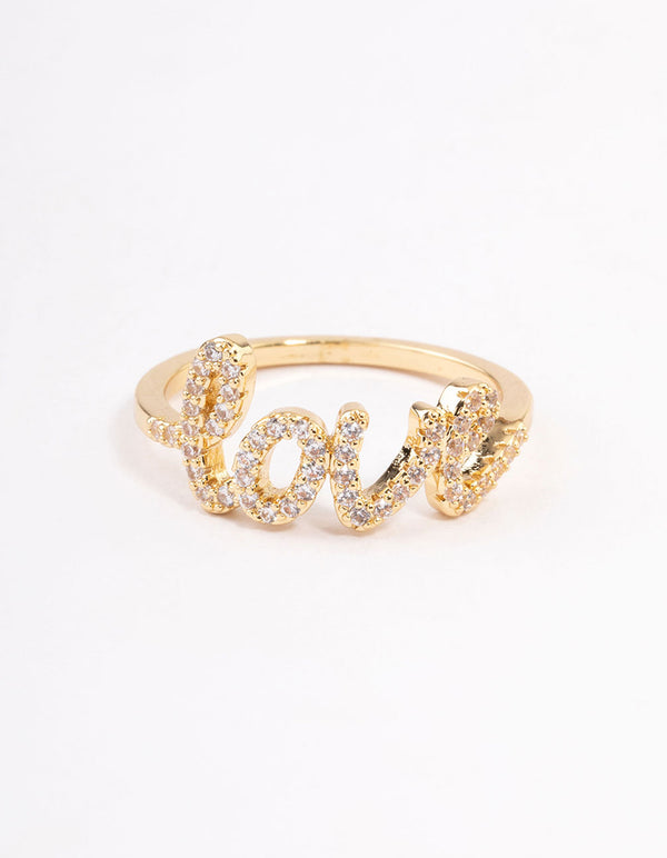 Capturing a gold plated love script ring adorned with crystals close up view