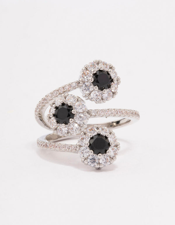 Beautifully designed black round triple tier ring with round stone cut in silver and white tones close up view