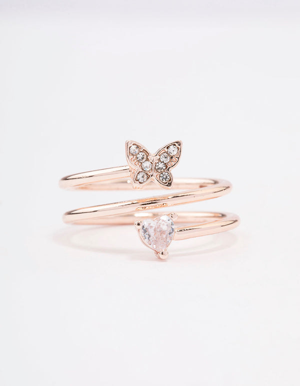 Highlighting a rose gold plated butterfly and heart wrapped ring close up view