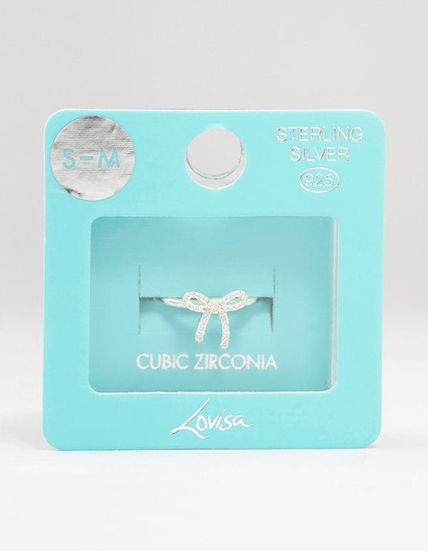 Showcasing sterling silver cubic zirconia bow ring in white close up view