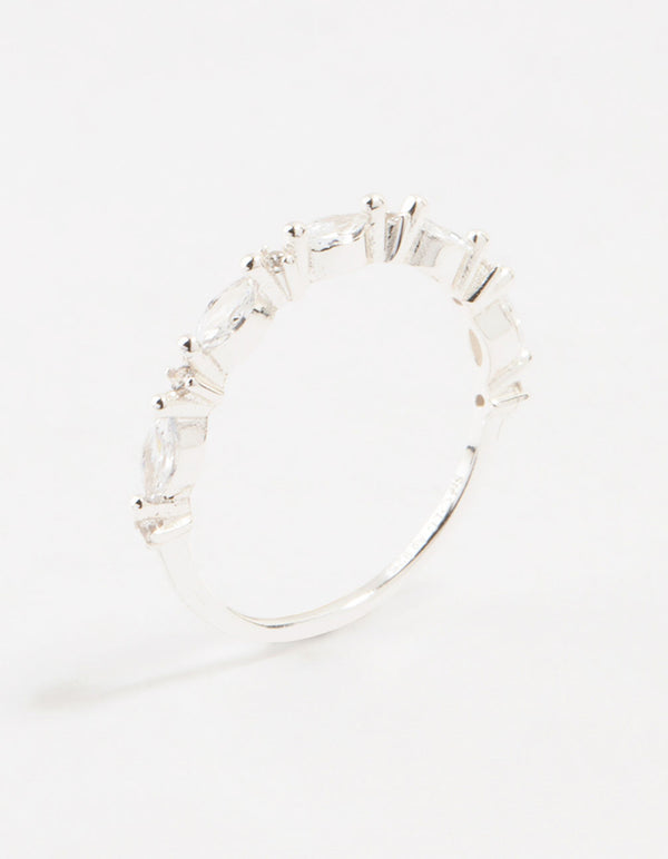 Showcasing a sterling silver ring with alternating marquise and round cubic zirconia stones side detail view