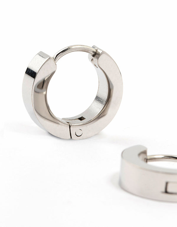 Presenting waterproof stainless steel wide huggie earrings in silver close up view
