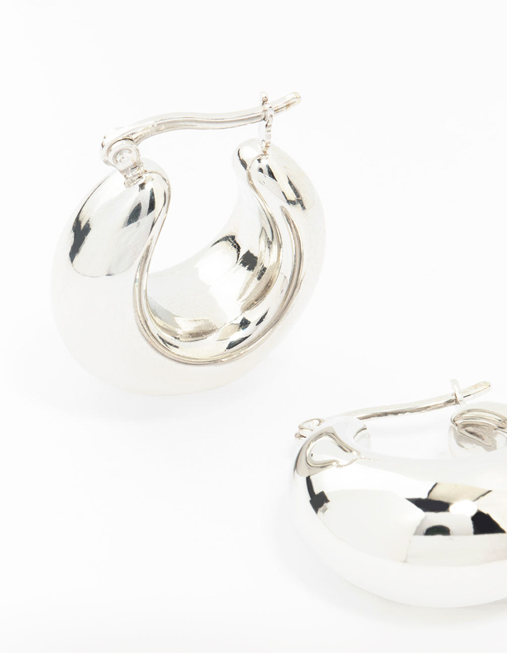 These waterproof stainless steel full bubble hoop earrings feature a polished silver finish close up view